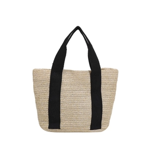 Minimalist straw tote bag with black woven handles and cream white chevron pattern weave