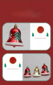 Macro detail of painted metal Christmas bells with tree patterns and festive hanging loops