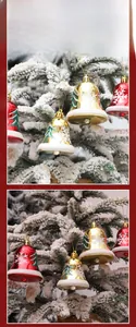 Detail of red and gold Christmas bells with snowflake patterns hanging on snowy branches