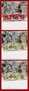 Detail of Christmas bell ornaments set with snow-covered tops and glitter tree patterns