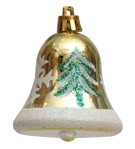 Macro detail of golden Christmas bell with glittery tree and snowflake patterns