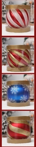 Detail of glittery stripe and snowflake Christmas ornaments in transparent cylindrical packaging