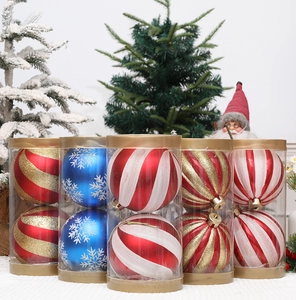 Macro detail of Christmas pumpkin balls with colorful stripes in festive gift packaging