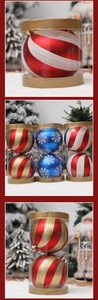 Detail view of colorful striped Christmas baubles in cylindrical gift packaging
