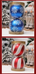 Detail of blue snowflake and red spiral Christmas baubles in transparent cylinder boxes