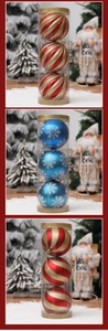 Detailed view of 3-pack glitter and snowflake Christmas ornaments in tall cylinders