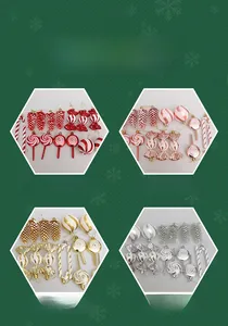 Close-up of red and white candy cane, pine cone, and striped ball Christmas ornaments