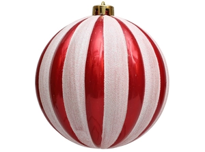 Close-up of red and white striped Christmas pumpkin ball ornament with gold cap