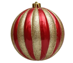 Macro detail of red and gold striped Christmas pumpkin ball ornament with hanging loop