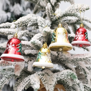Christmas bell ornaments in red and gold with snowflake patterns for tree decoration