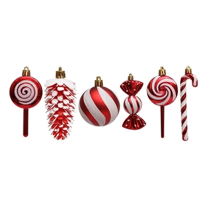 Set of red and white Christmas ornaments with candy canes and pinecones on white background