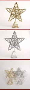 Detail of gold and silver glittery star tree toppers with spiral spring base stands