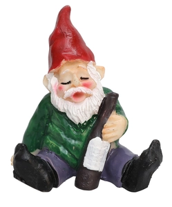 Detail of funny drunk garden gnome ornament with red hat and wine bottle