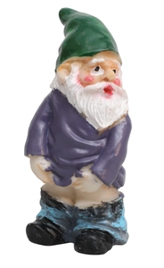 Detailed view of a funny garden gnome figurine with white beard and green hat