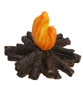 Detailed macro view of miniature resin campfire ornament with faux wood base and flame