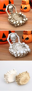 Detailed view of skull-shaped skeleton tray in bone and white resin for gothic decor