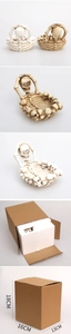 Close-up of resin skull ashtray with detailed skeleton carvings and gothic ornament