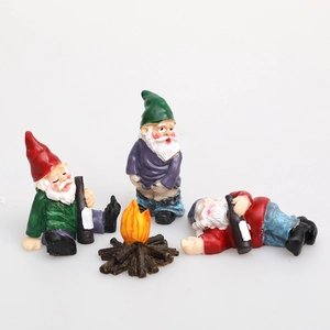 Set of 4 garden gnome figurines with a small campfire featuring funny outdoor poses