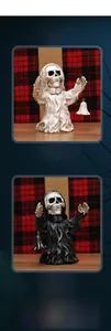 Detail view of gothic skull figurine with hanging bell for Halloween table decoration