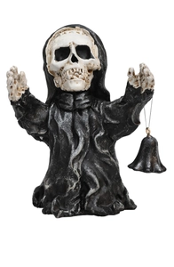 Macro detail of resin skeleton figurine with black tattered cloak holding a small bell
