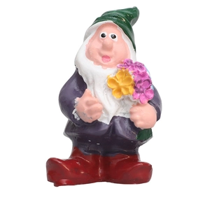 Detail of garden gnome resin figurine holding a colorful bouquet of flowers