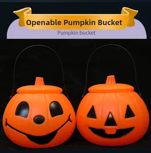 Macro detail of openable orange Halloween pumpkin buckets with black handles