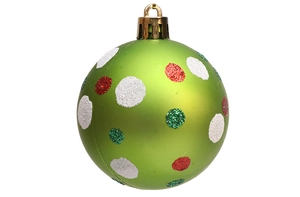 Detail of green matte Christmas ball with red and white glitter dots and golden hook cap