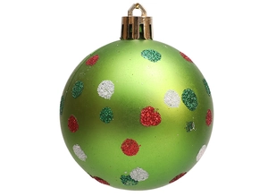Macro detail of 6cm green Christmas ball with red and white glitter polka dots for decoration