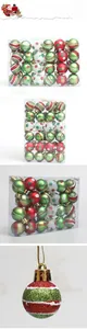 Detail of red, green and white painted Christmas ball ornaments in transparent packaging