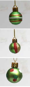 Detail showing hand-painted green Christmas balls with red glitter stripes and polka dots