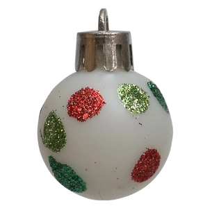 Detail of white Christmas ball ornament with vibrant red and green glitter dots
