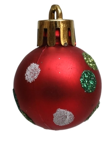 Macro detail of red Christmas ball with white and green glitter dots for holiday decor