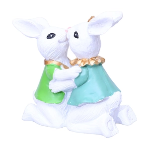 Kissing Easter bunnies figurines in white resin with green outfits for home decor