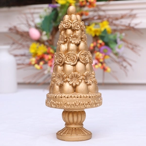 Vintage golden cone resin ornament with embossed floral relief for home garden decor