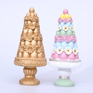 Floral cone resin garden ornaments in gold and pastel colors with rose relief carvings