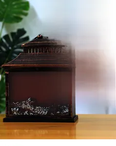 Macro detail of fireplace lantern featuring retro gold finish and realistic faux charcoal