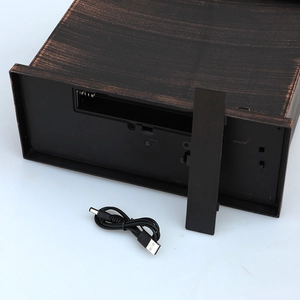 Fireplace lantern featuring a vintage bronze finish, battery compartment, and USB power cable