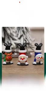 Detail of Christmas wind-up toys with Santa and Reindeer featuring music and light effects