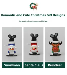 Detail view of wind-up Christmas toys including Santa, Snowman and Reindeer characters