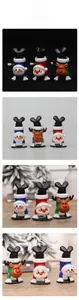 Three-piece wind-up Christmas toys featuring Santa, snowman, and reindeer in handstand pose