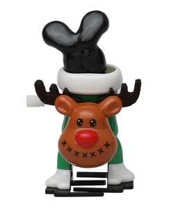 Detailed close-up of a wind-up Christmas reindeer toy with mechanical knob and festive colors