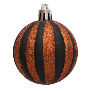 Detail of Halloween ball ornament with black matte and orange glitter stripes on white background
