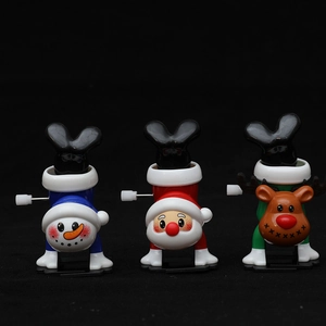 Three-piece wind-up Christmas toys featuring Santa, snowman and reindeer in handstand poses