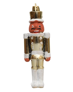 Detail der Nussknacker-Figur mit goldener Beschichtung und glitzerndem Schneeeffekt