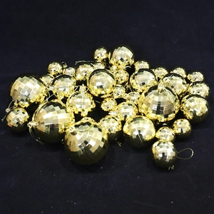 Golden mirror disco balls in various sizes with hanging strings for Christmas party decor