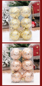 Detail of 6cm gold and rose gold Christmas balls with star embossed texture in clear box