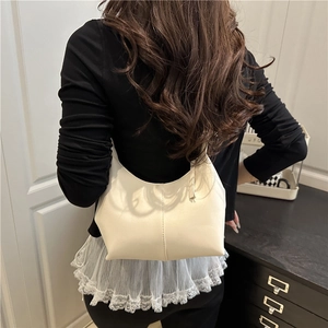 Minimalist beige bucket bag with vertical seam detail shown as a chic shoulder crossbody bag