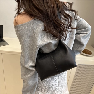 Minimalist black matte hobo shoulder bag with vertical stitching and textured PU leather