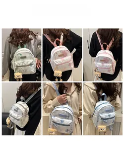 Mini nylon backpack with floral patterns and plush charm shown from multiple angles