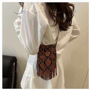 Detailed back view of a retro snakeskin crossbody phone bag with tassel trim and slim strap